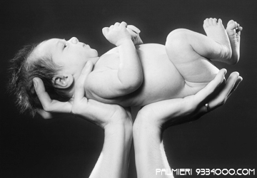 newborn cradle in hands