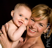 newborn with mom smiling